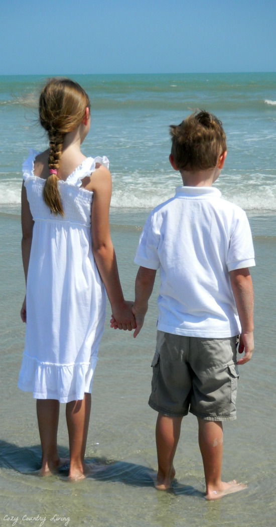 Children Holding Hands at The Beach