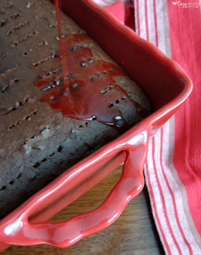 Pouring Cherry JELLO Mixture over Chocolate Cake