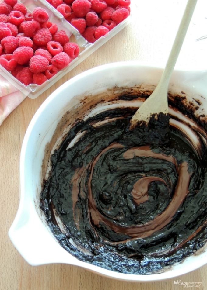Mixing in Chocolate into Dark Chocolate Raspberry Brownies