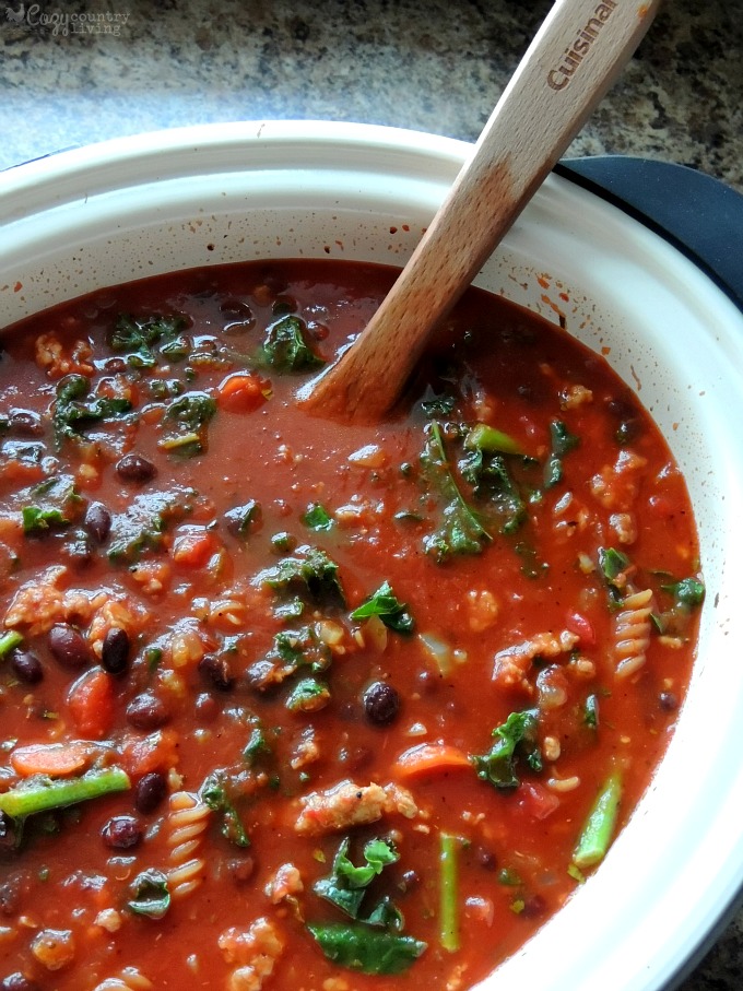 Mixing Kale & Pasta into Spicy Sausage & Black Bean Soup