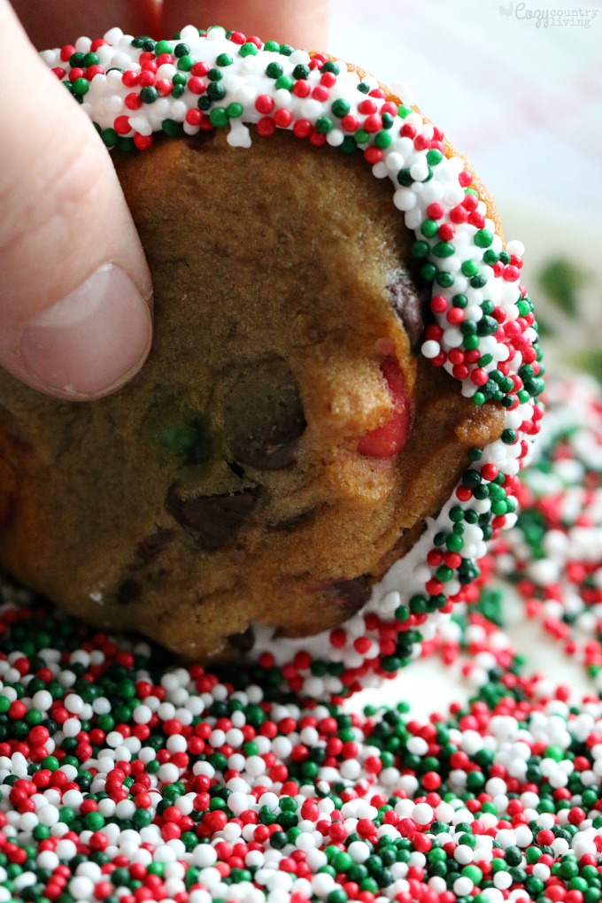 Rolling Holiday Chocolate Chip & Marshmallow Cookies in Sprinkles