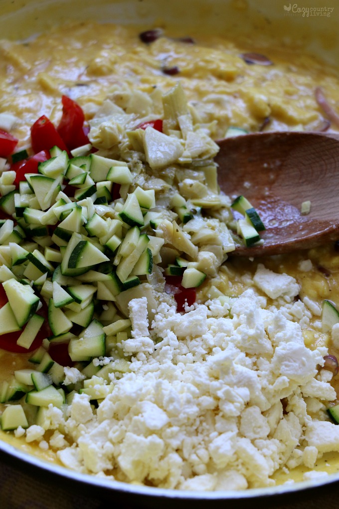Adding Vegetables & Feta Cheese to Eggs for Greek Breakfast Wraps