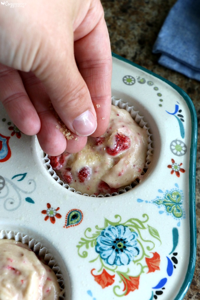 Sprinkle Raw Sugar onto Wild Strawberry Muffins