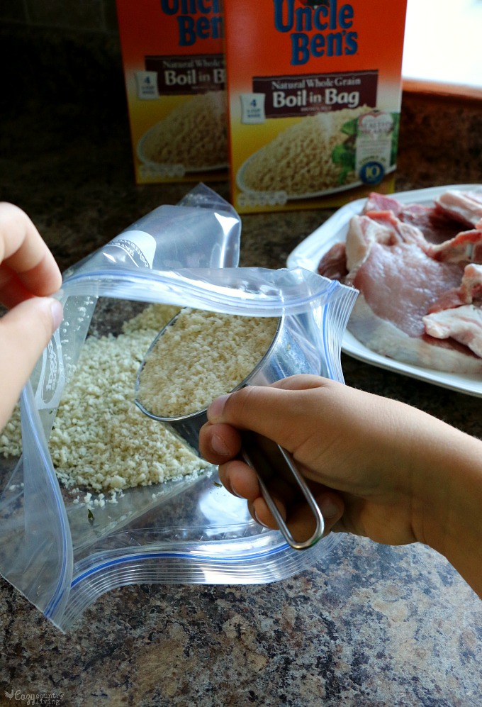 Adding Breadcrumbs and Spices for Pork Chops to Bag