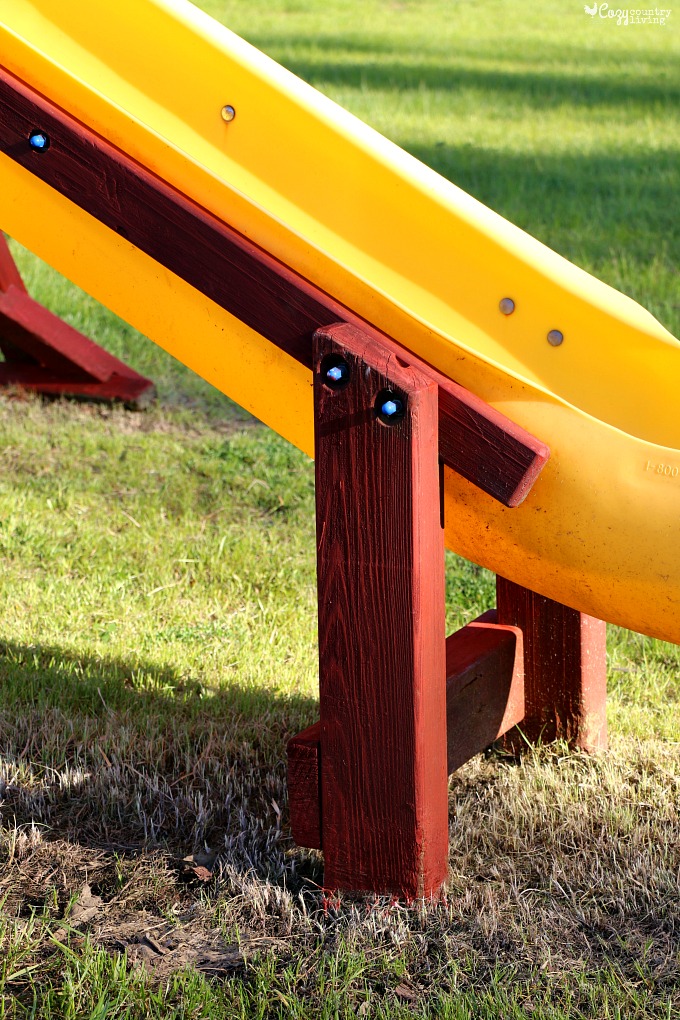Use Redwood Stain to Freshen Up the Playset's Wood Frame